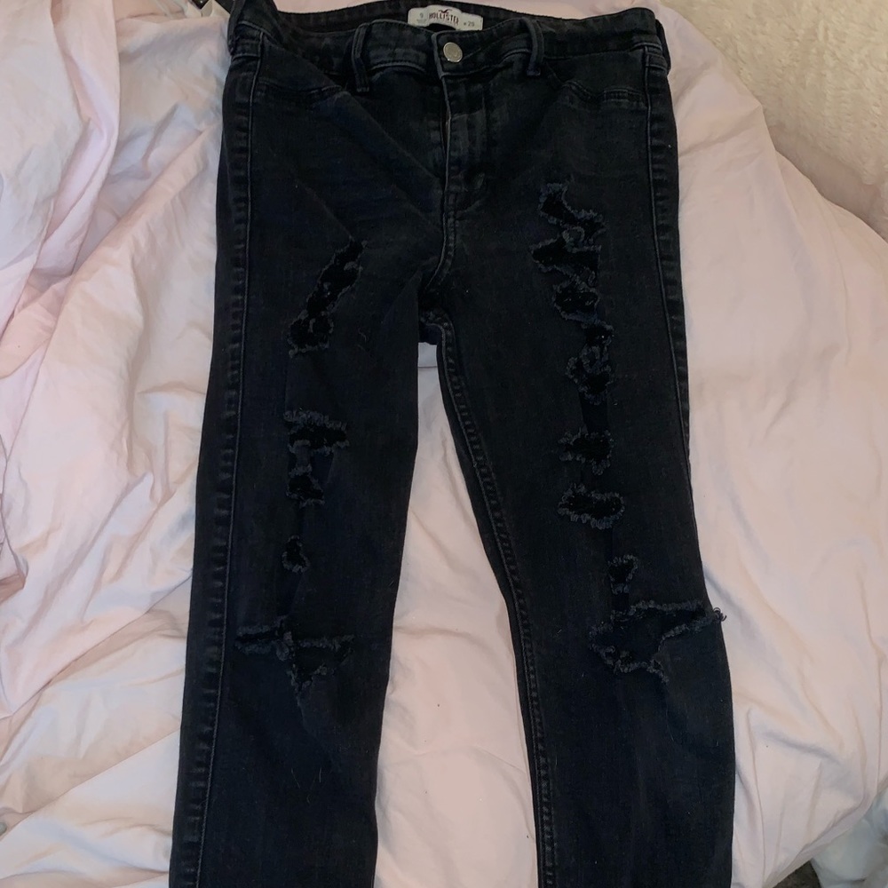Black ripped jeans.